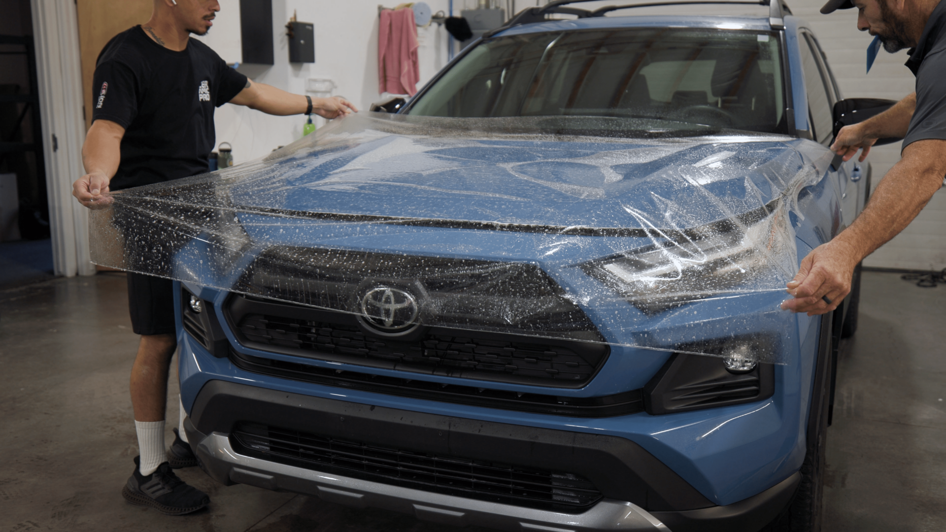 Ceramic infused paint protection film stretched over hood